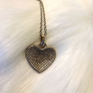 Silver heart shaped necklace on silver chain